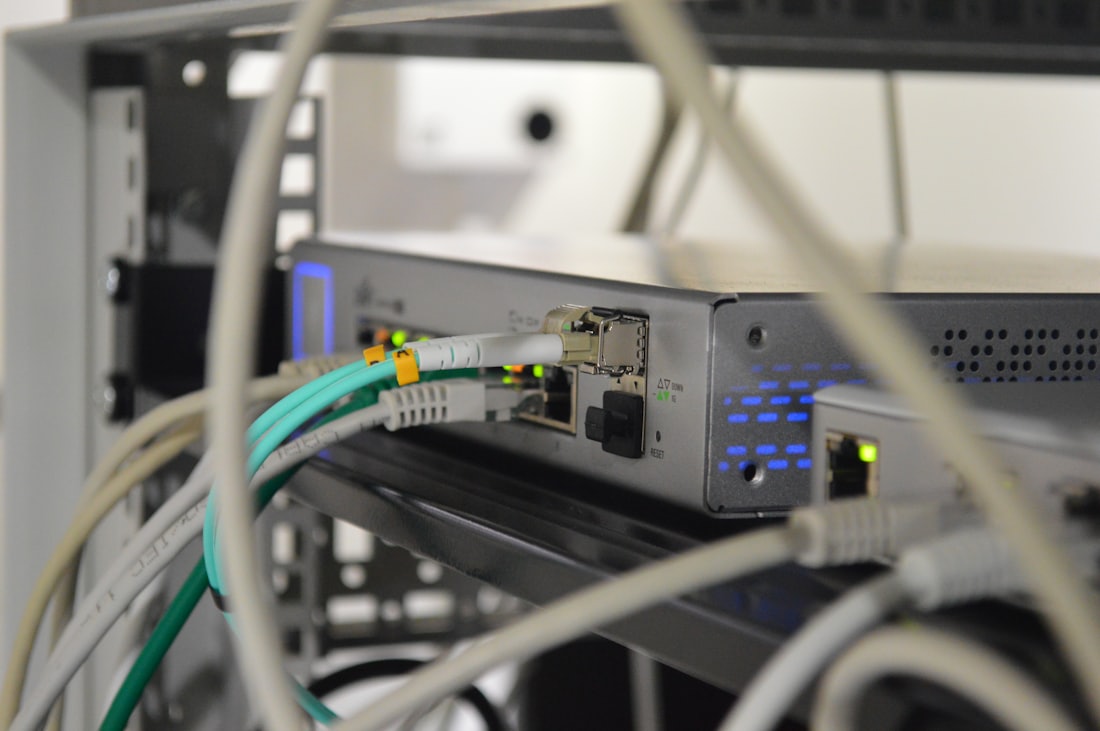 Close-up of a network switch with connected cables